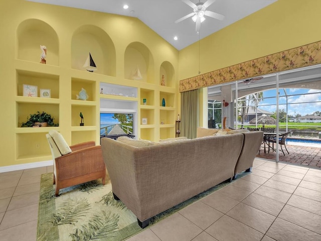 tiled living area with built in features, a ceiling fan, high vaulted ceiling, recessed lighting, and a sunroom