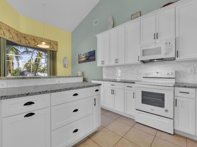 kitchen featuring white appliances, visible vents, lofted ceiling, white cabinetry, and backsplash