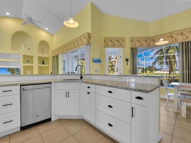 kitchen featuring light tile patterned floors, a sink, ceiling fan, and stainless steel dishwasher