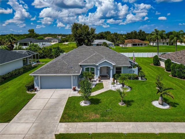 ranch-style house with a front lawn and a garage