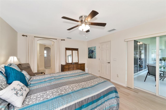 bedroom featuring access to outside, ceiling fan, and light hardwood / wood-style flooring