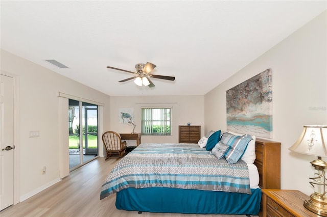 bedroom featuring light hardwood / wood-style floors, ceiling fan, and access to outside