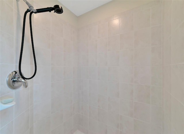 bathroom with a tile shower