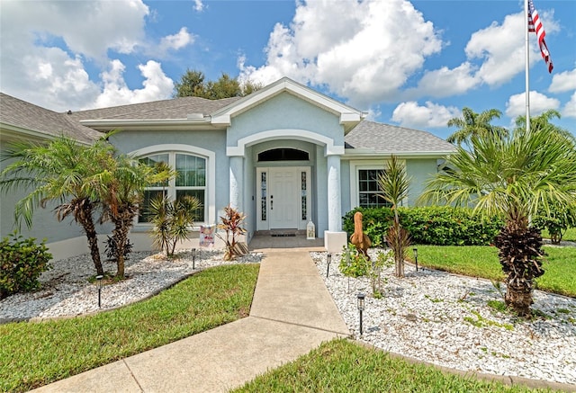 view of front of home with a front yard