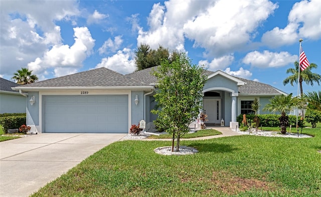 single story home featuring a front yard and a garage