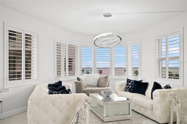 living room featuring baseboards and marble finish floor