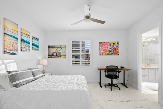 bedroom with marble finish floor, baseboards, a ceiling fan, and ensuite bathroom