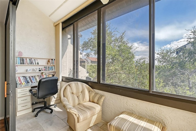 tiled office featuring lofted ceiling