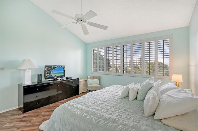 bedroom featuring lofted ceiling, ceiling fan, and hardwood / wood-style floors