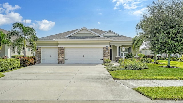 view of front facade featuring a garage and a front lawn