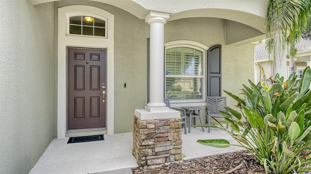 doorway to property featuring covered porch