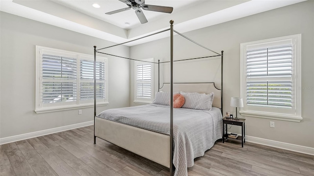 bedroom featuring hardwood / wood-style floors and ceiling fan