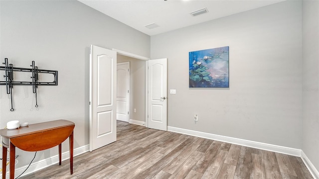 bedroom with light hardwood / wood-style floors