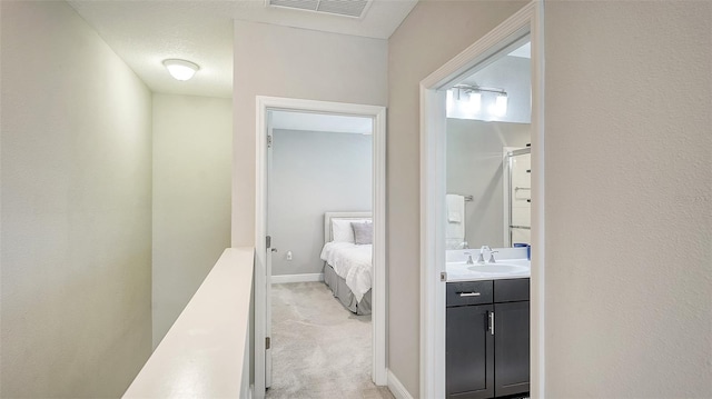 bathroom featuring vanity and a textured ceiling