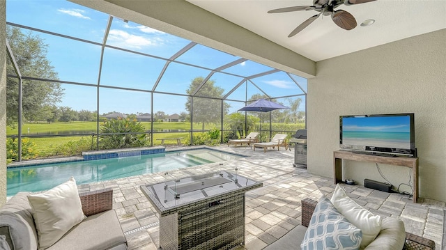 view of pool with ceiling fan, a patio, an outdoor hangout area, glass enclosure, and a hot tub