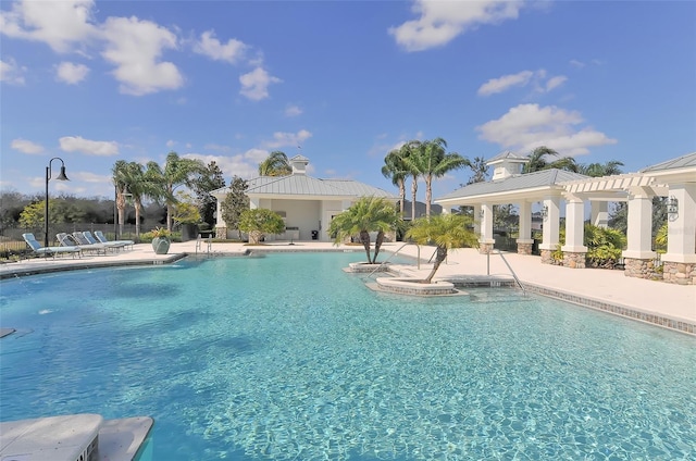 view of swimming pool with a patio area