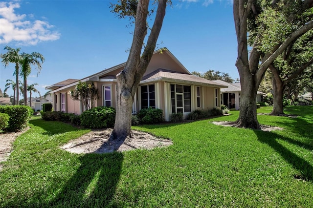 rear view of property with a yard