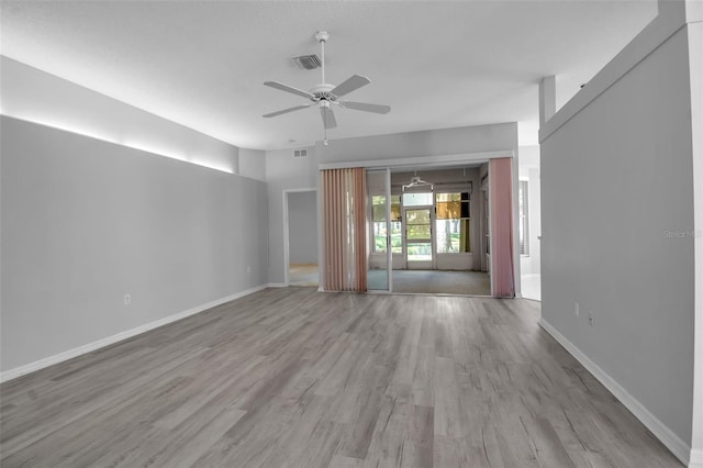 spare room with light hardwood / wood-style floors and ceiling fan