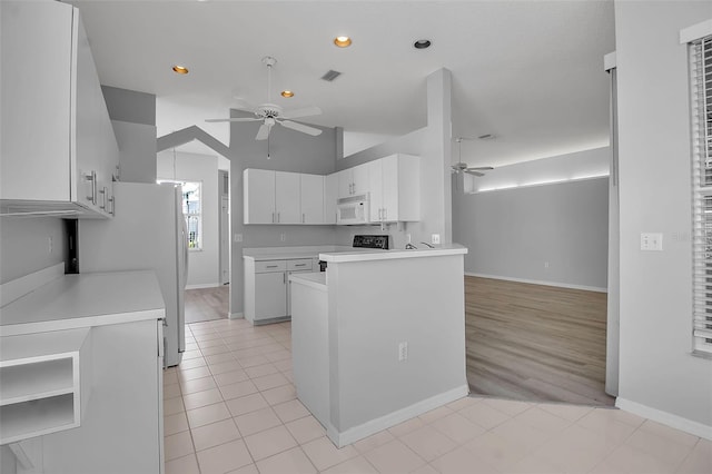 kitchen featuring white cabinetry, white appliances, kitchen peninsula, light wood-type flooring, and ceiling fan