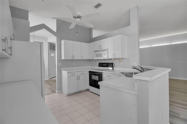 kitchen featuring white appliances, sink, ceiling fan, and white cabinets