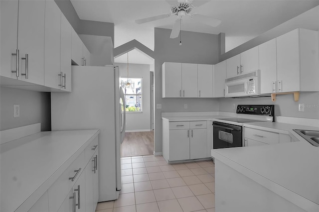 kitchen with white cabinets, white appliances, ceiling fan, and light tile patterned flooring