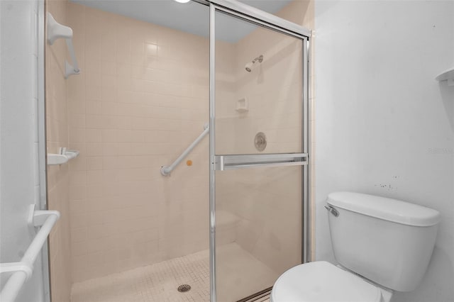 bathroom with walk in shower and toilet