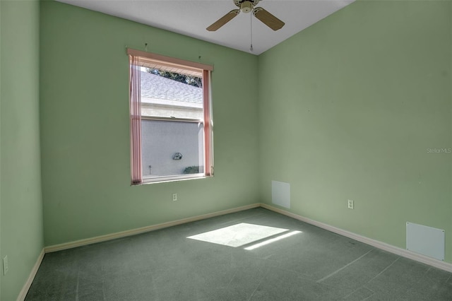 spare room featuring ceiling fan and carpet floors