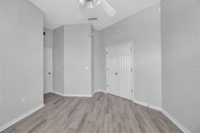 unfurnished bedroom featuring ceiling fan, a closet, and light hardwood / wood-style flooring