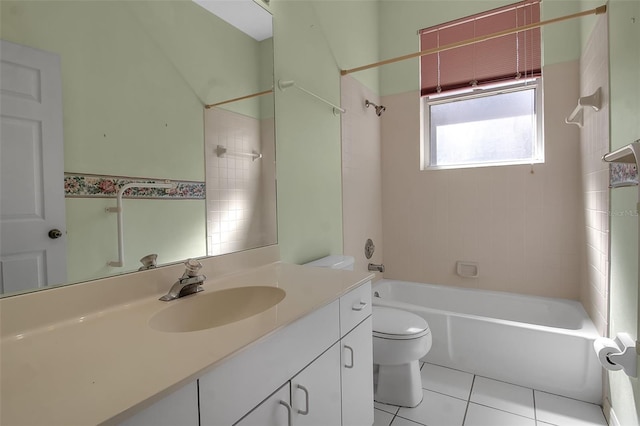 full bathroom featuring tiled shower / bath combo, vanity, toilet, and tile patterned floors