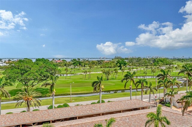 view of community with golf course view and a water view