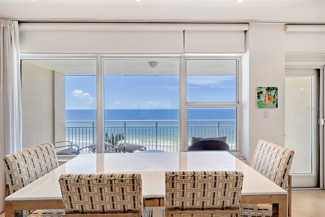 dining space featuring a water view