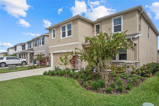 view of front of house featuring a garage and a front lawn