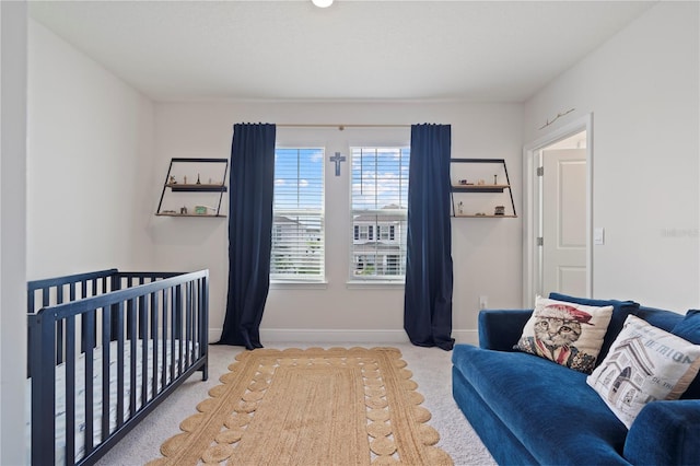 bedroom featuring light carpet