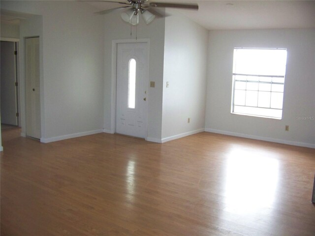 entryway with ceiling fan and hardwood / wood-style floors