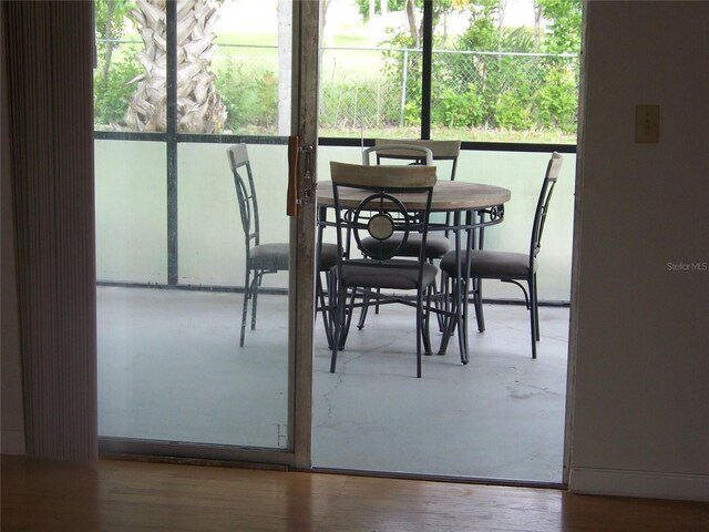 dining room with hardwood / wood-style flooring