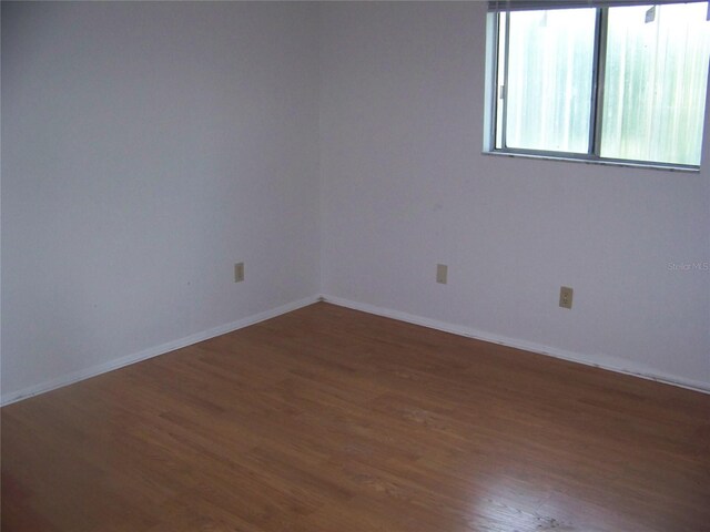 empty room featuring wood-type flooring