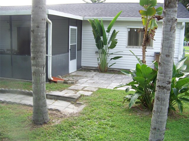 view of yard featuring a sunroom