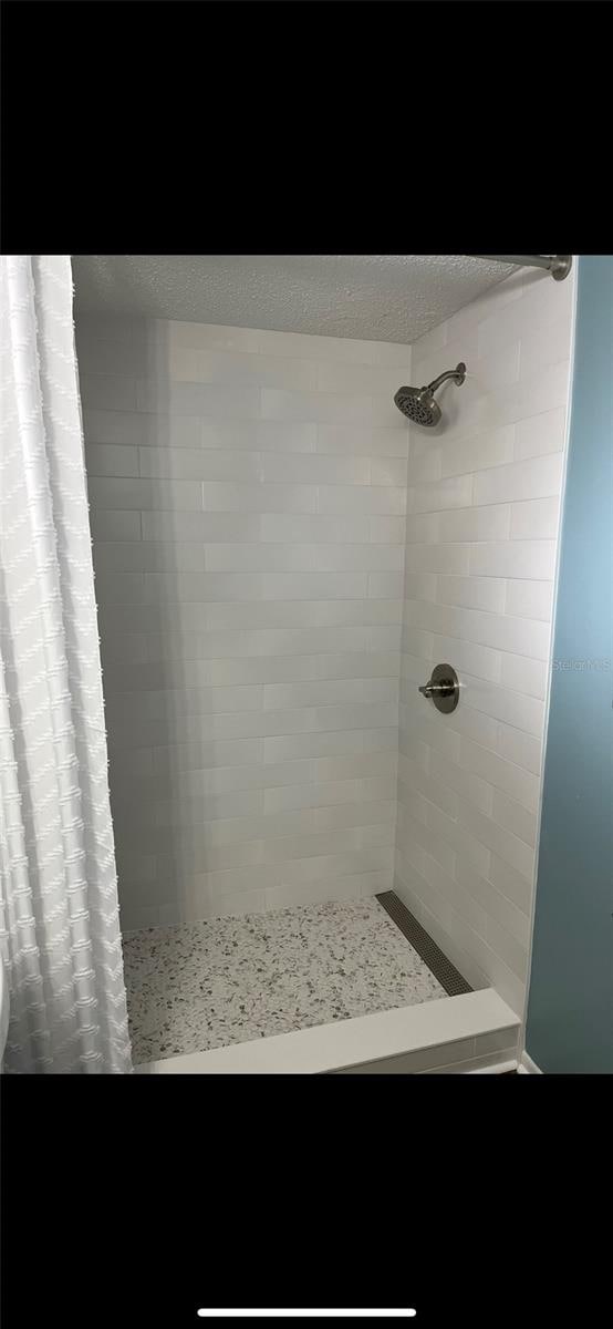 bathroom featuring curtained shower