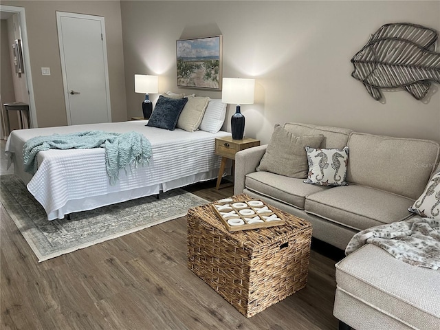 bedroom with dark hardwood / wood-style floors