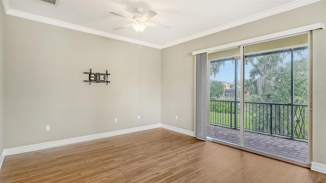 spare room featuring crown molding, ceiling fan, and hardwood / wood-style flooring