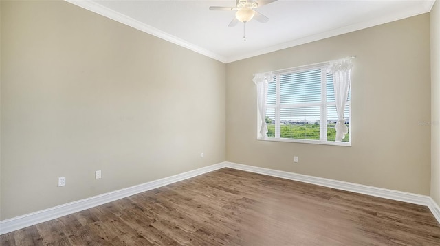 empty room featuring hardwood / wood-style floors, ceiling fan, and ornamental molding