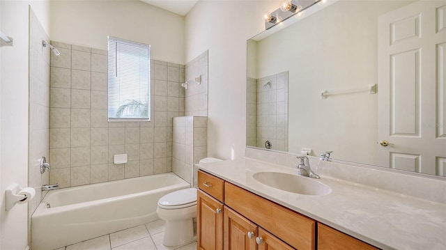 full bathroom with tile patterned flooring, vanity, toilet, and tiled shower / bath