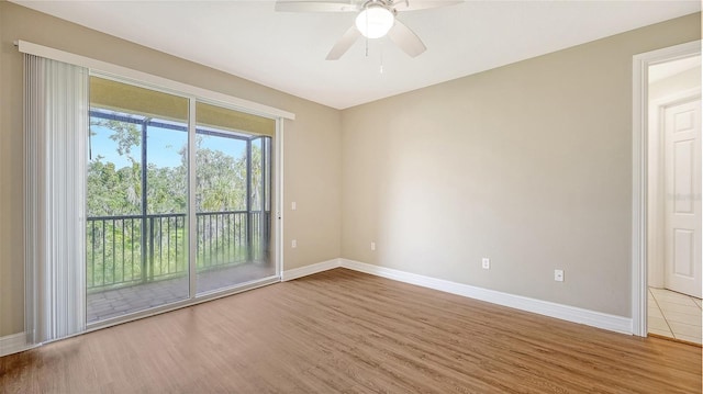 unfurnished room featuring hardwood / wood-style flooring and ceiling fan