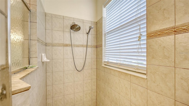 bathroom with tiled shower