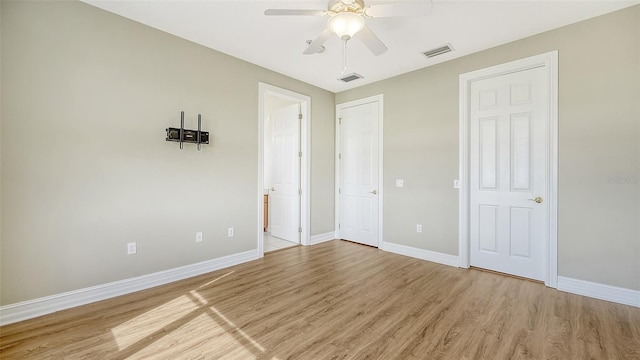 unfurnished bedroom featuring light hardwood / wood-style flooring and ceiling fan