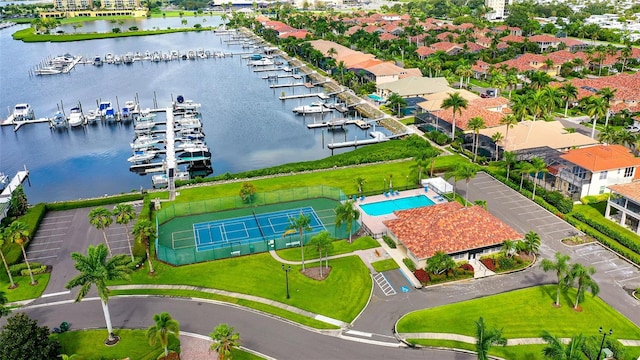 birds eye view of property with a water view