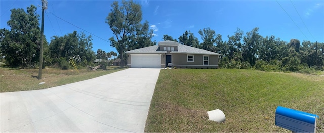 single story home with a garage and a front yard