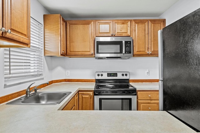 kitchen featuring stainless steel appliances and sink