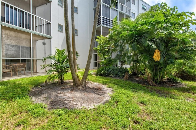 view of yard featuring a balcony and a patio area