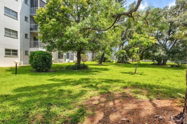 view of yard featuring a balcony